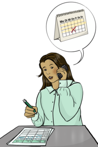 Eine Person ist am Telefon und macht einen Termin aus. 